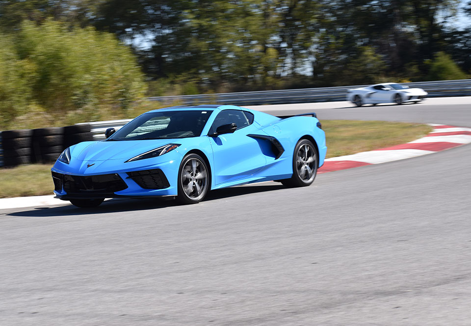 Blue and white Corvettes racing