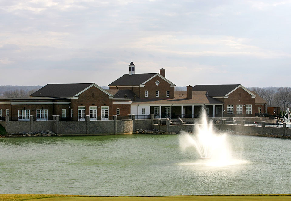 Clubhouse next to lake fountain